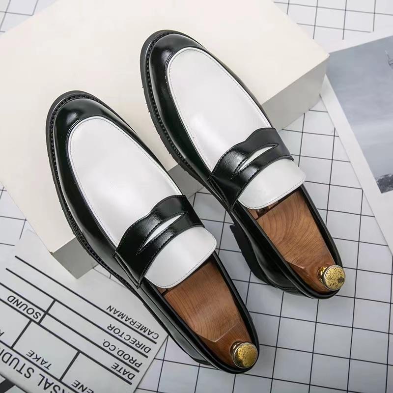 Black and white panelled British loafers