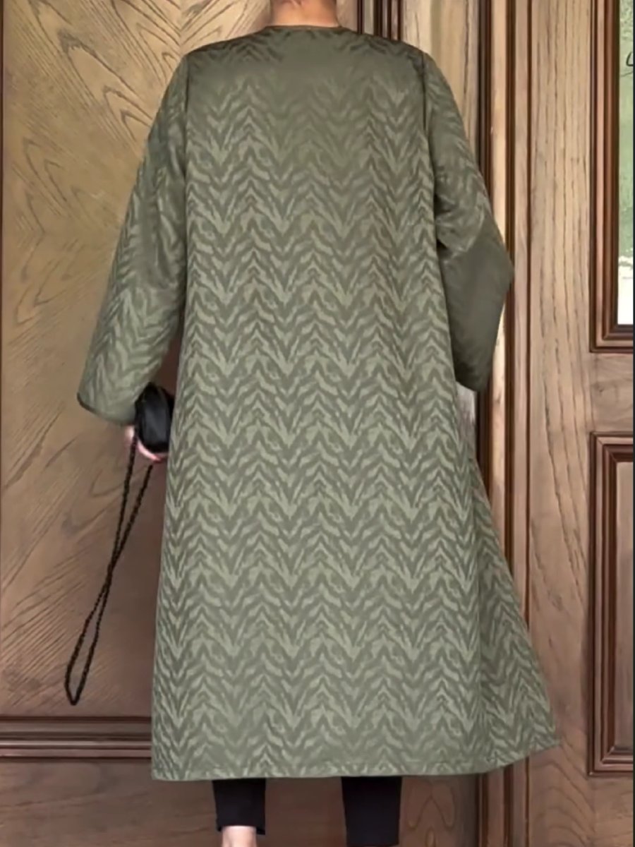 A textured all-over patterned green jacket